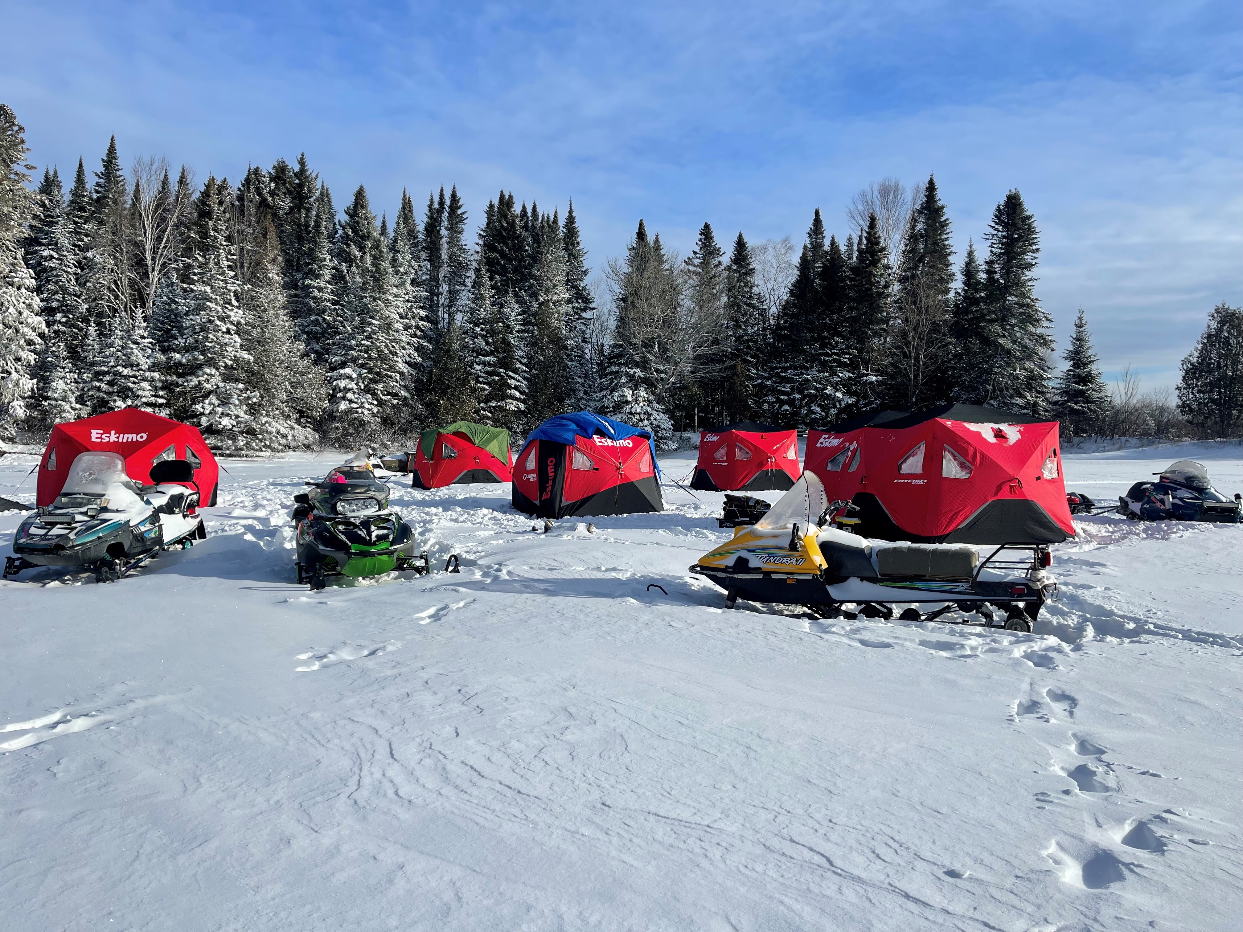 Image of Cullen's camp set up on the ice of Chamberlain Lake.