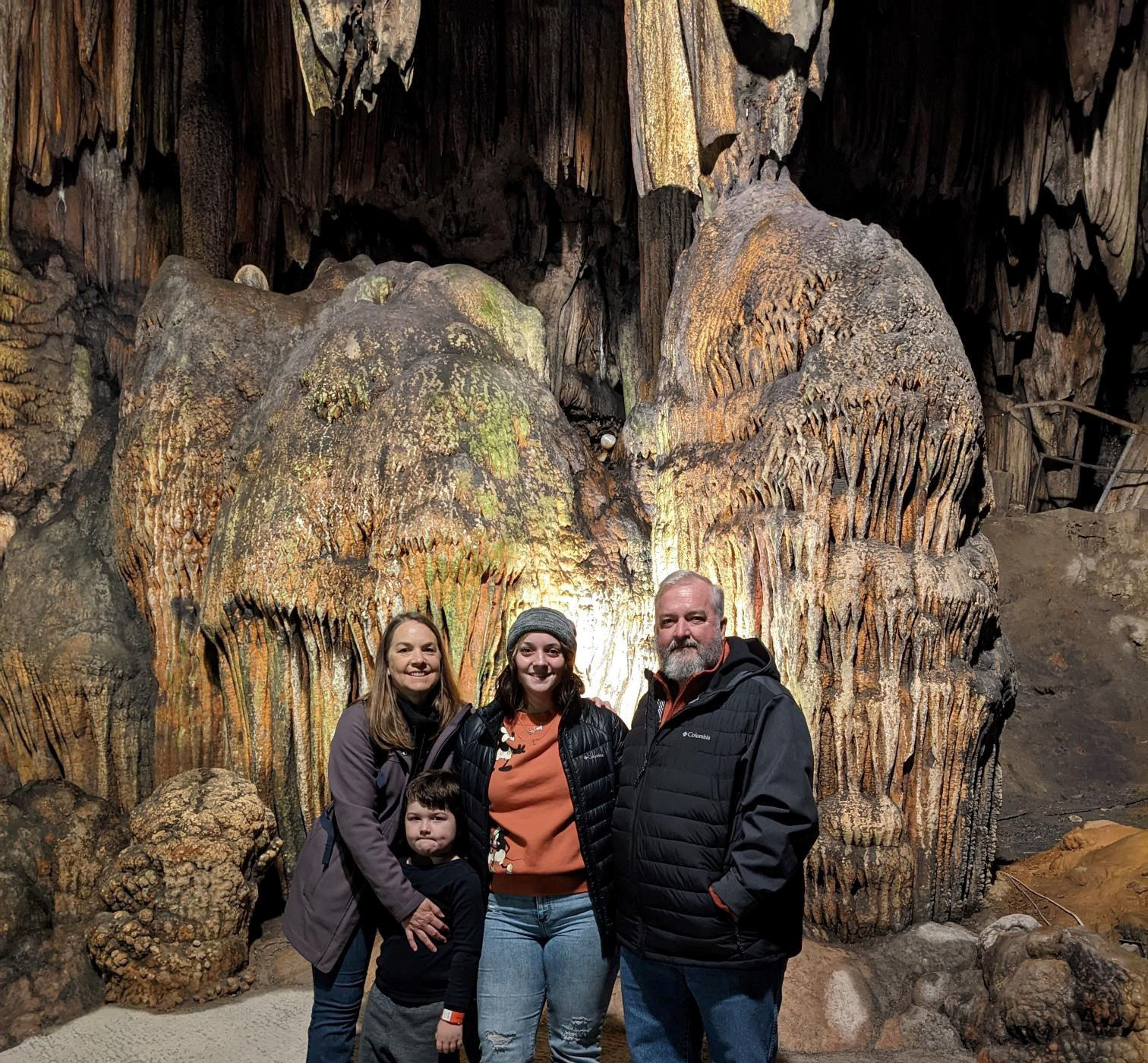 Image of Zaina and her family inside a cavern.