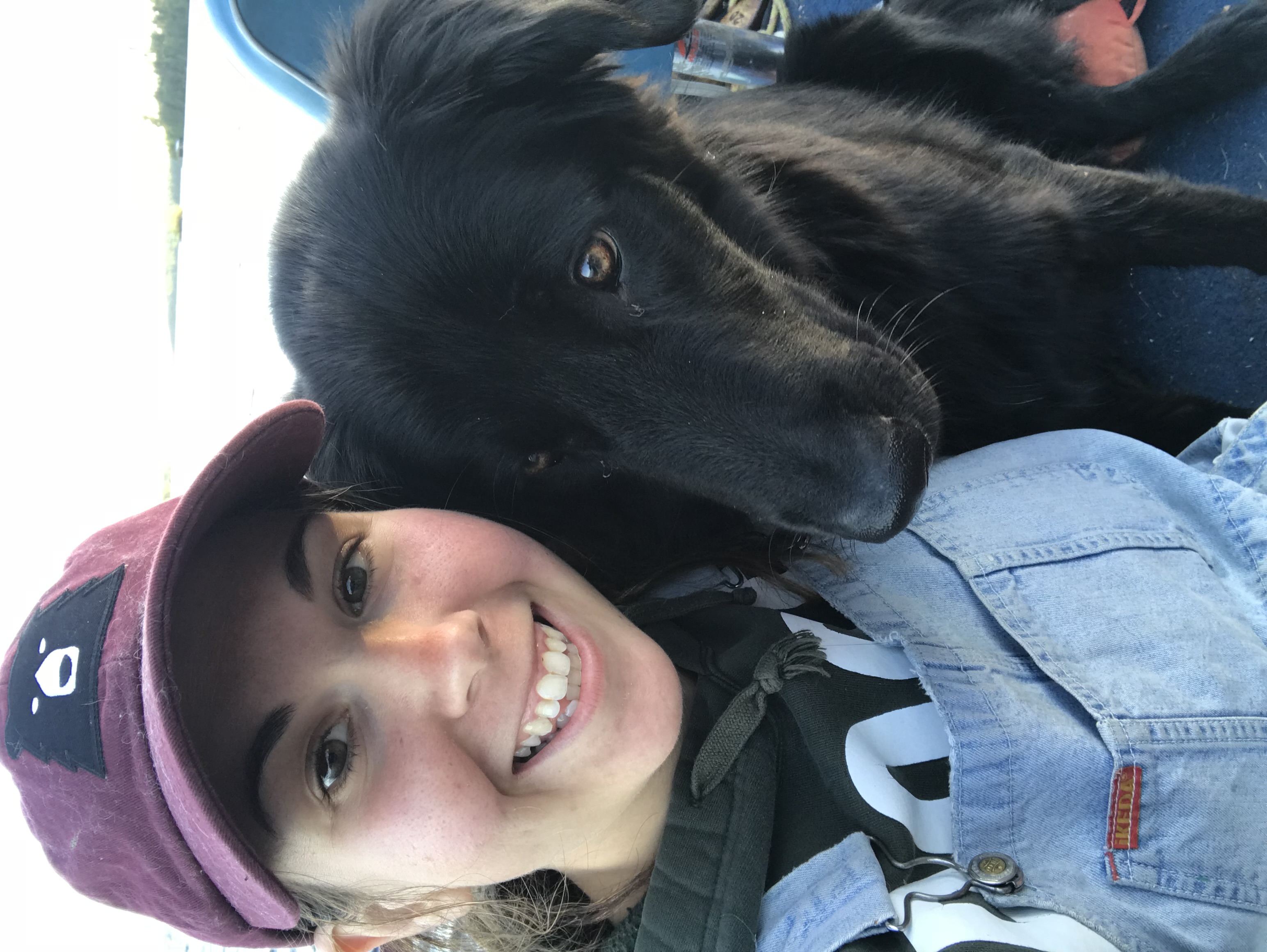 Image of Maddie boating on Lake of the Woods with her dog, Roofus.