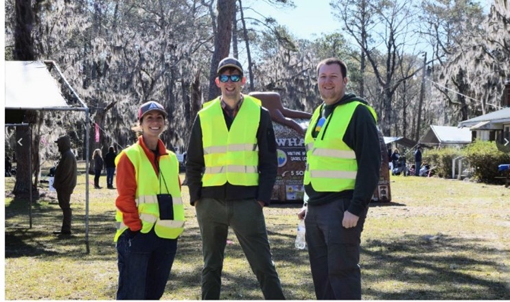Image of group of three people standing at the Cool Springs Envionmental Education Center.
