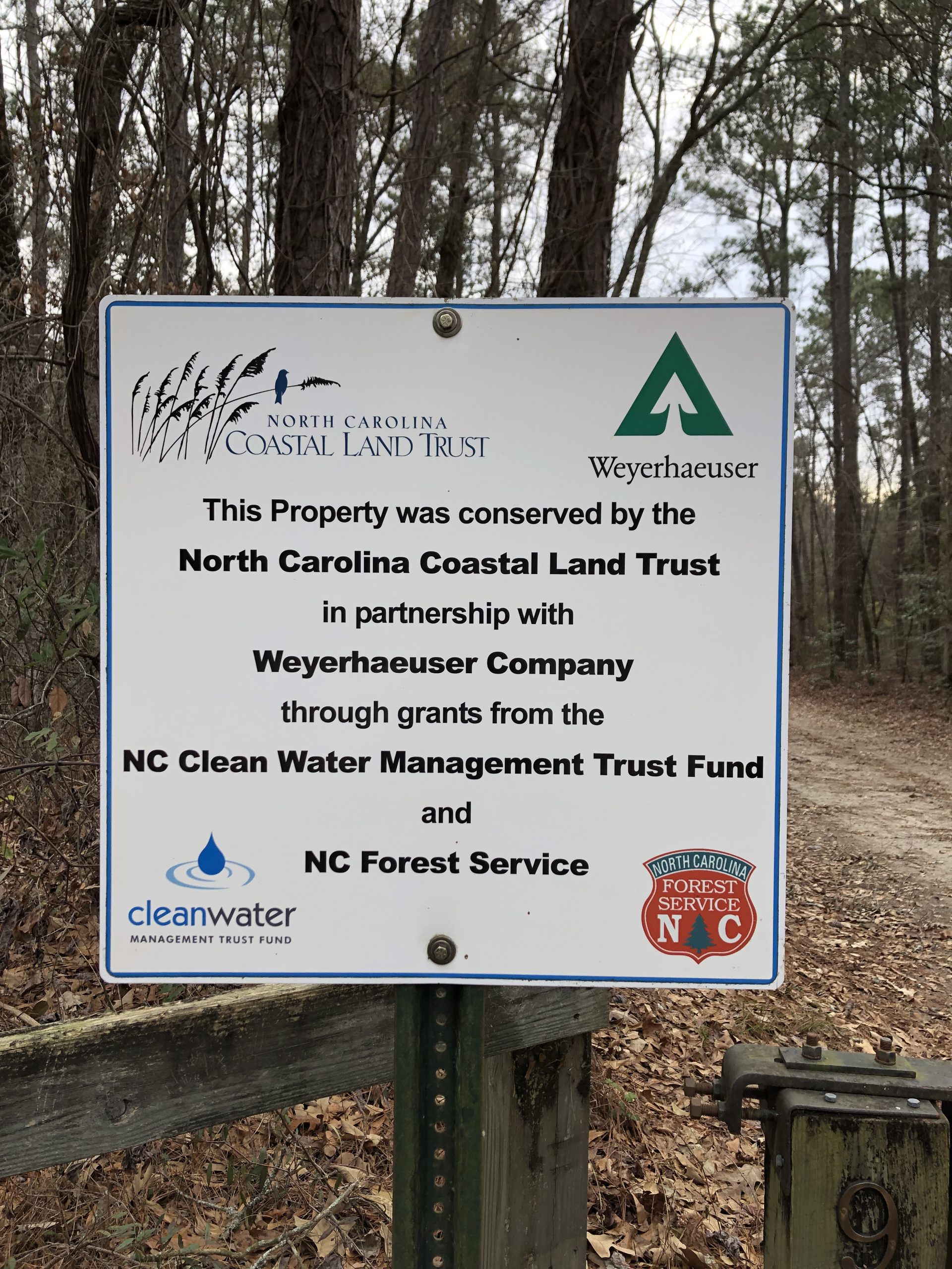 Image of a sign acknowledging the partnership between the North Carolina Coastal Land Trust and Weyerhaeuser.