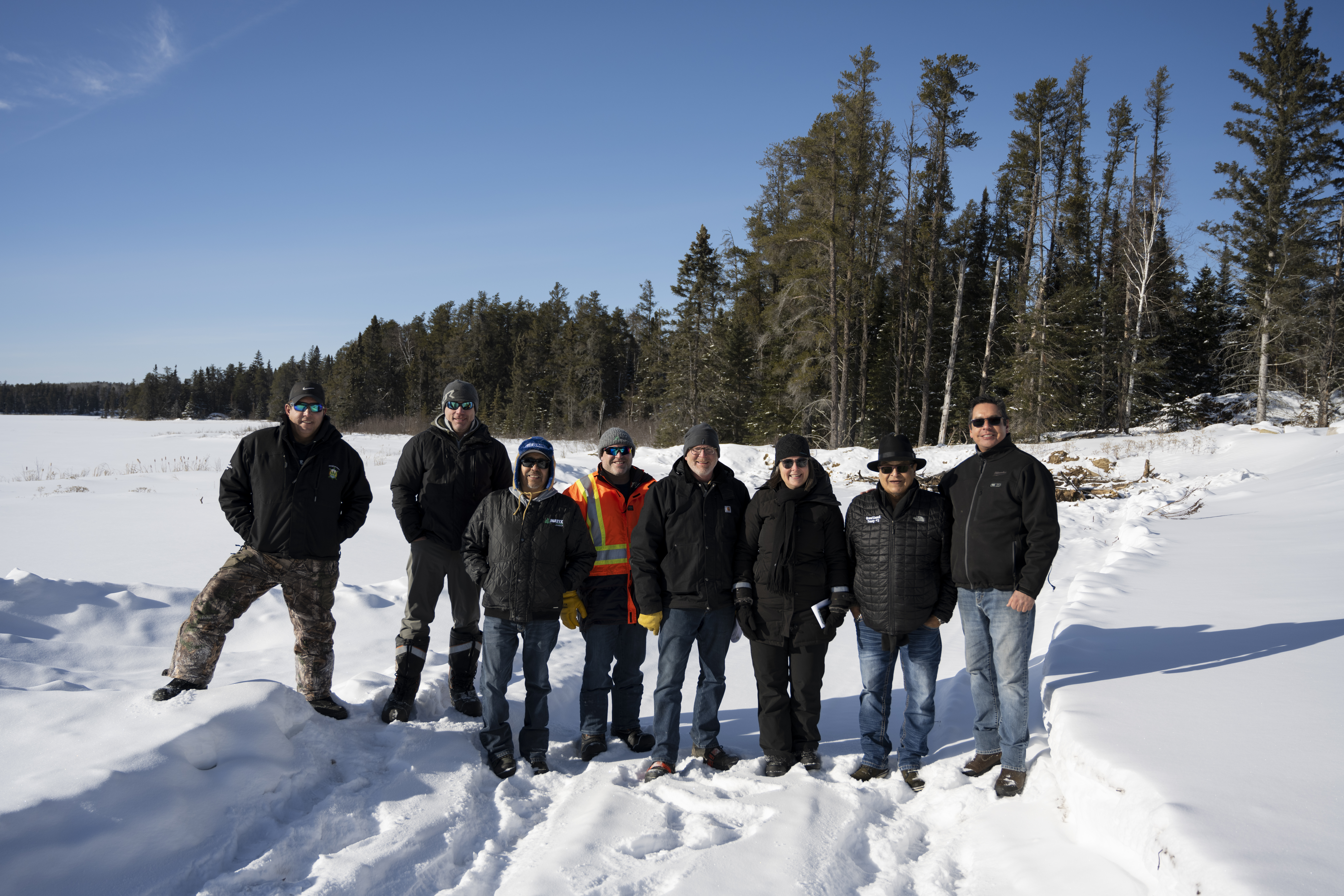Image of Erik Holmstrom with internal and external partners during a recent visit to Gamikaan Bimaadiziwin.