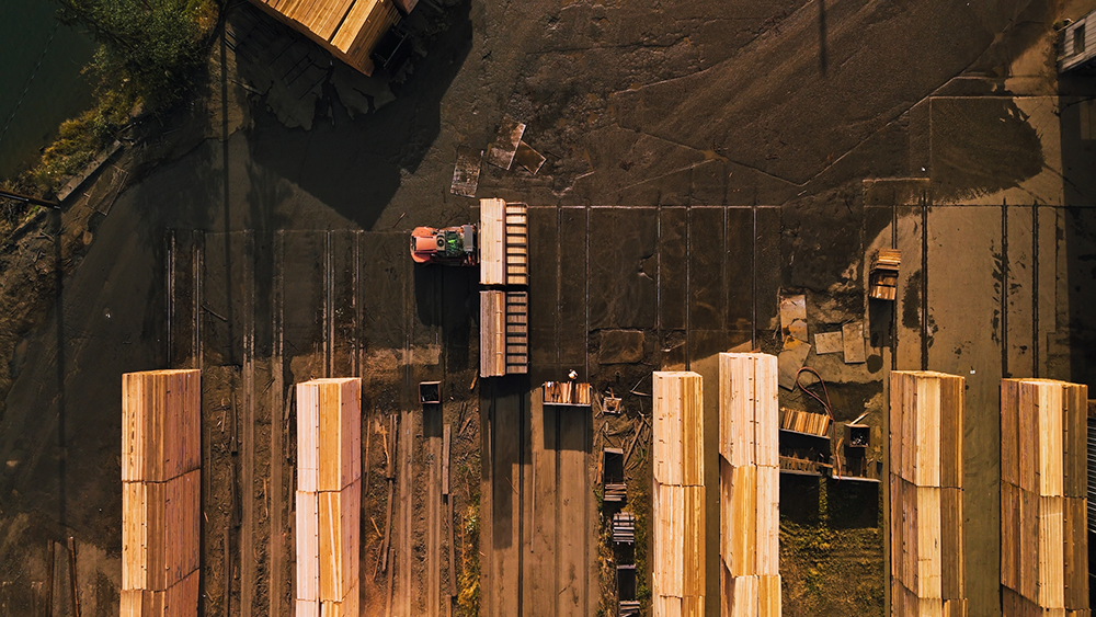 Huge stacks of logs are seen from drone footage at the Weyerhaeuser timber yard.