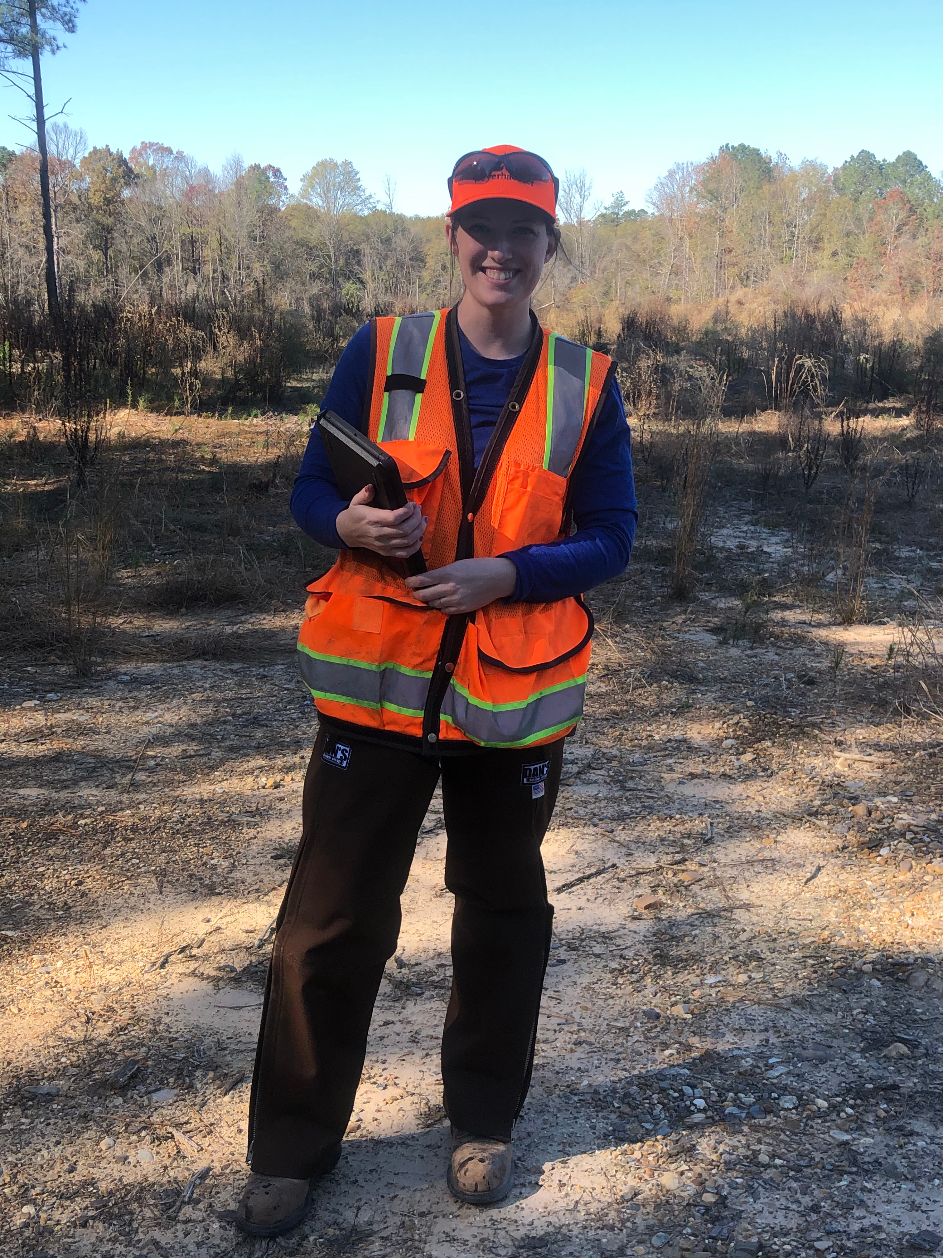 Image of Rebekah using her iPad to input survival survey data directly into the Survey 123 application in the field.